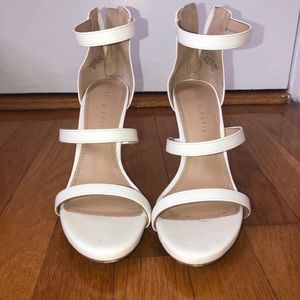 Kelly and Katie white heels